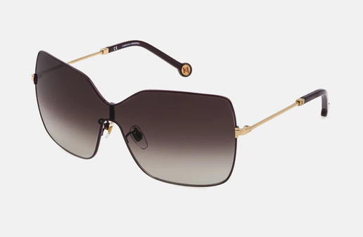 Gafas de Carolina Herrera de montura al aire en dorado. Gafas de Carolina Herrera de montura al aire en dorado.